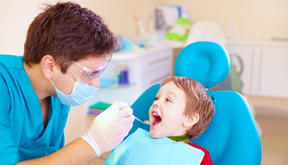 young boy in dental chair