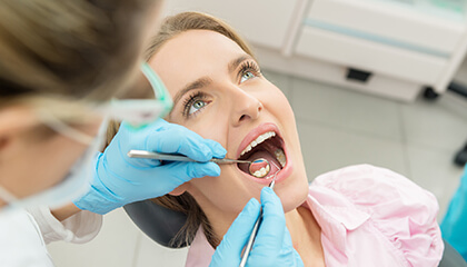 Female patient examined by the dentist