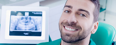 Smiling man relaxed in dental office