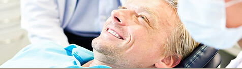 Male patient smiling in dental chair