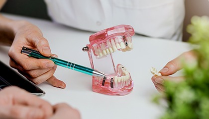 a patient and dentist speaking during a consultation 