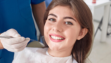 Young woman smiling in dental chair