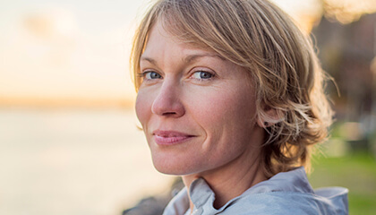 Female patient smiling at sunset