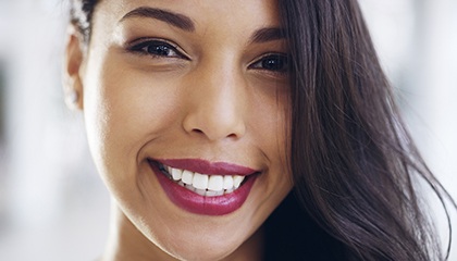 a patient smiling after her smile makeover