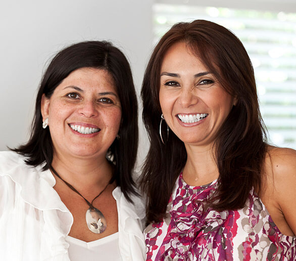 Two smiling female dental patients