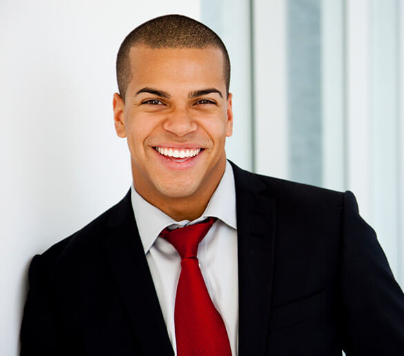 Smiling young man wearing business suit and tie