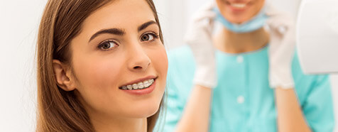 Female patient with clear and tooth-colored six month smiles braces