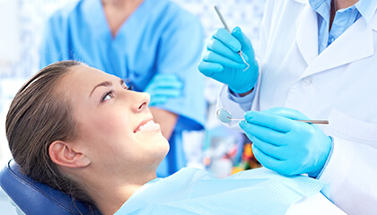 Female patient smiling at dentist