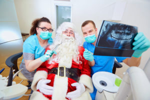 Santa sitting in dentist chair