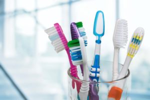 Assortment of toothbrushes in cup