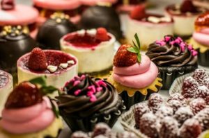 An array of cupcakes and other desserts