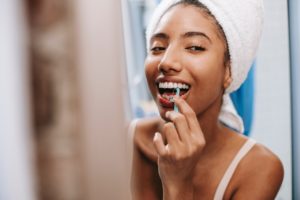 Woman learning why flossing is important