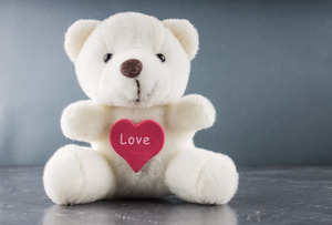 teddy bear that says "love"